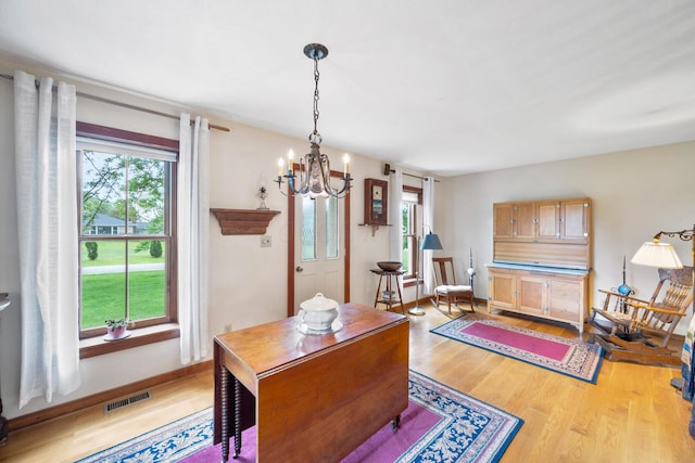 13535 Vans Valley Rd, Galena, OH 43021 - office area featuring light wood finished floors, a chandelier, and baseboards
