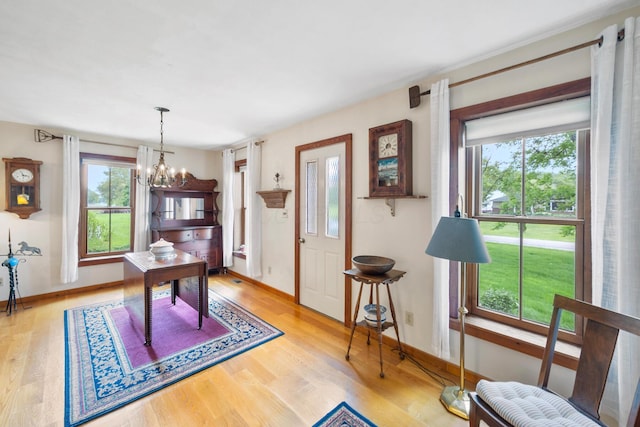 13535 Vans Valley Rd, Galena, OH 43021 - dining room featuring healthy amount of natural light, a chandelier, and wood finished floors