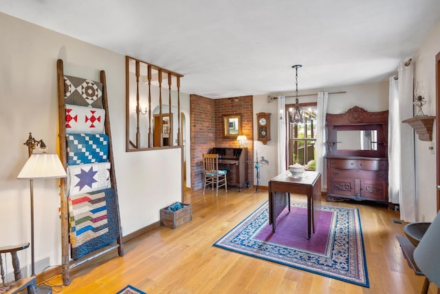 13535 Vans Valley Rd, Galena, OH 43021 - dining room with wood finished floors, arched walkways, and a chandelier