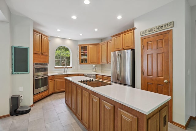 7235 Ballou Rd, Heath, OH 43056 - kitchen with stainless steel appliances, a sink, a center island, light countertops, and recessed lighting