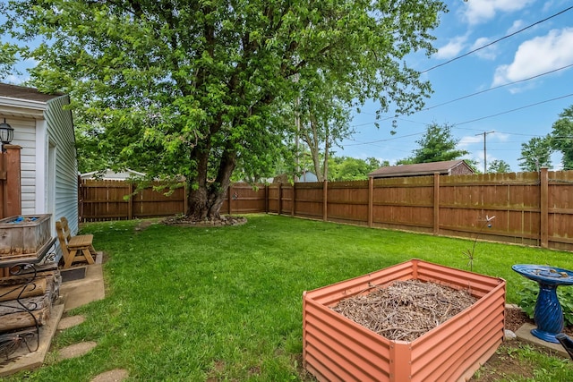 19 Vaughn Rd, Delaware, OH 43015 - fenced backyard with a garden