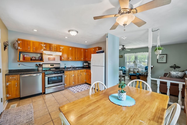19 Vaughn Rd, Delaware, OH 43015 - kitchen with appliances with stainless steel finishes, under cabinet range hood, dark countertops, a ceiling fan, and recessed lighting