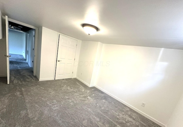 19966 Happy Hollow Rd, Laurelville, OH 43135 - unfurnished bedroom with dark colored carpet and baseboards