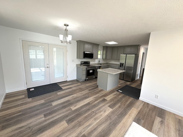 19966 Happy Hollow Rd, Laurelville, OH 43135 - kitchen featuring appliances with stainless steel finishes, gray cabinetry, a chandelier, baseboards, and a textured ceiling