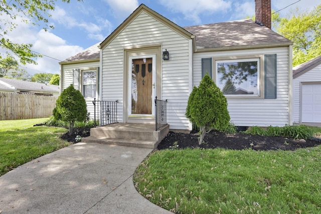 206 Goose Pond Rd, Newark, OH 43055 - view of front of house featuring a chimney, roof with shingles, and a garage