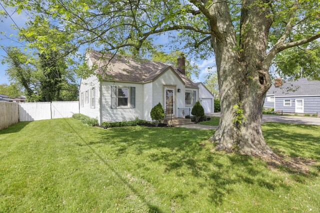 206 Goose Pond Rd, Newark, OH 43055 - view of front facade featuring a chimney and a garage