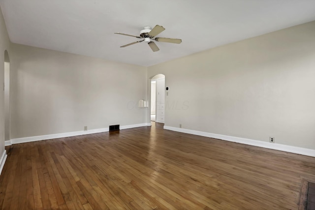 206 Goose Pond Rd, Newark, OH 43055 - spare room with arched walkways, a ceiling fan, hardwood / wood-style floors, and baseboards