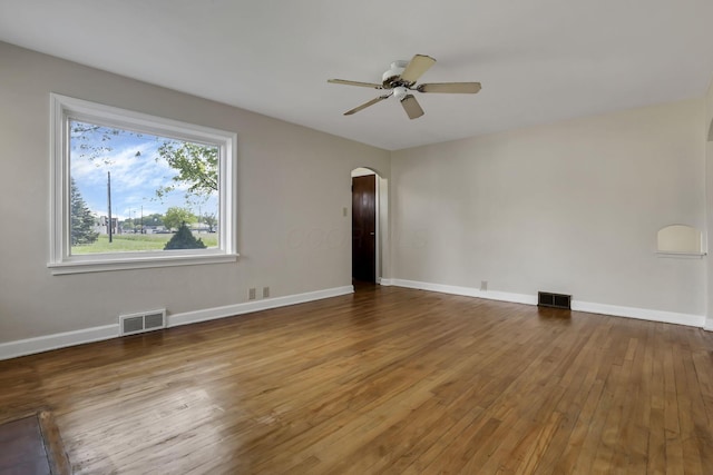 206 Goose Pond Rd, Newark, OH 43055 - empty room featuring arched walkways, hardwood / wood-style floors, ceiling fan, and baseboards