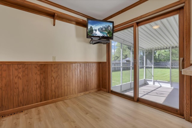 206 Goose Pond Rd, Newark, OH 43055 - doorway to outside featuring light wood-style floors, wainscoting, and wood walls