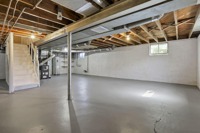 206 Goose Pond Rd, Newark, OH 43055 - below grade area featuring electric water heater, stairway, and heating unit