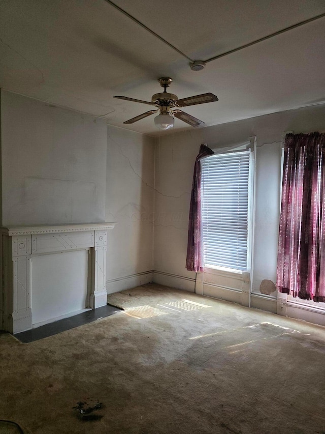 195 N Monroe Ave, Columbus, OH 43203 - unfurnished living room with a ceiling fan and carpet