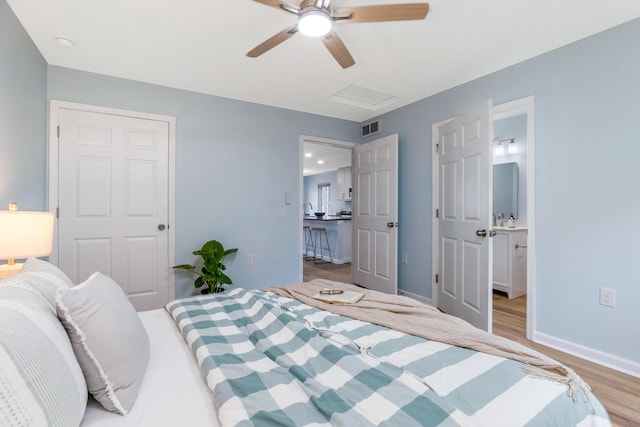 225 Reeb Ave, Columbus, OH 43207 - bedroom featuring light wood finished floors, attic access, and a ceiling fan