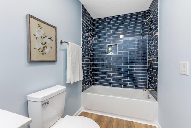 225 Reeb Ave, Columbus, OH 43207 - bathroom with wood finished floors, tub / shower combination, and vanity