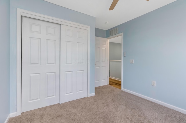 225 Reeb Ave, Columbus, OH 43207 - unfurnished bedroom featuring carpet, a closet, and ceiling fan