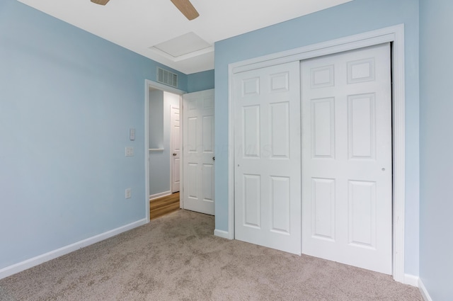 225 Reeb Ave, Columbus, OH 43207 - unfurnished bedroom featuring carpet, a closet, attic access, and a ceiling fan