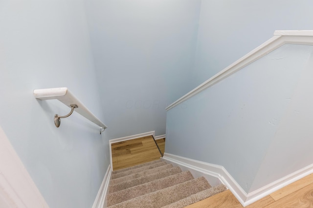 225 Reeb Ave, Columbus, OH 43207 - stairway with baseboards and wood finished floors