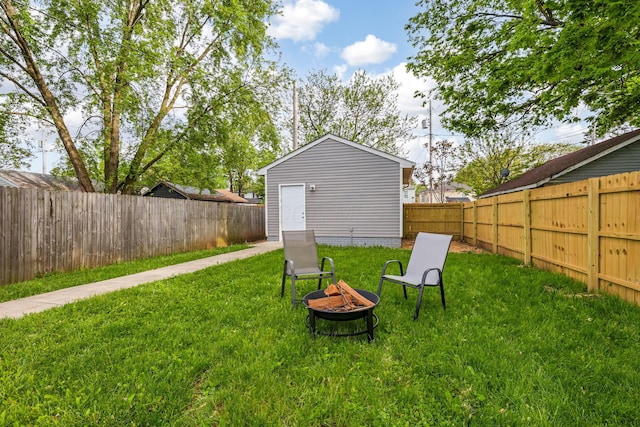 225 Reeb Ave, Columbus, OH 43207 - fenced backyard with a fire pit and an outbuilding