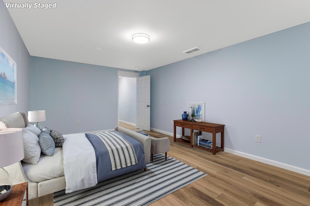 225 Reeb Ave, Columbus, OH 43207 - bedroom with light wood-style floors and baseboards