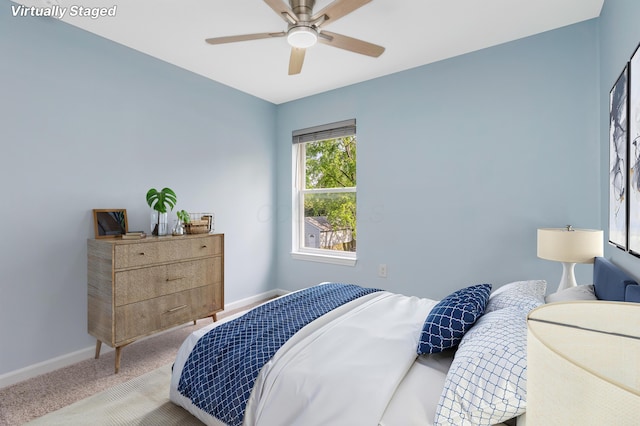 225 Reeb Ave, Columbus, OH 43207 - carpeted bedroom with baseboards and ceiling fan