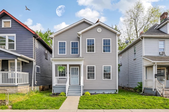 225 Reeb Ave, Columbus, OH 43207 - view of front of property with a front yard and cooling unit