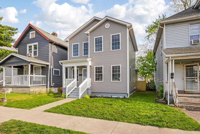 225 Reeb Ave, Columbus, OH 43207 - view of front of house with covered porch, a front yard, and cooling unit
