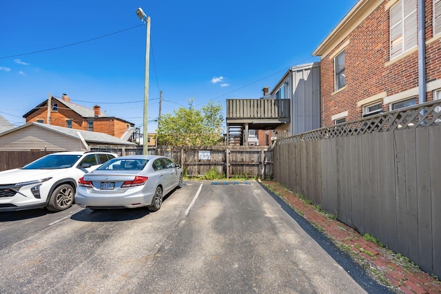 uncovered parking lot with fence
