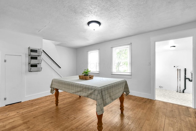 221 W Mulberry St, Baltimore, OH 43105 - rec room with light wood-type flooring, baseboards, and a textured ceiling