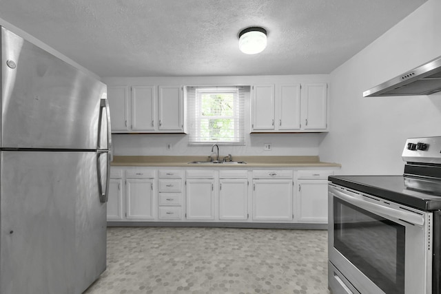 221 W Mulberry St, Baltimore, OH 43105 - kitchen featuring stainless steel appliances, extractor fan, a sink, a textured ceiling, and white cabinets