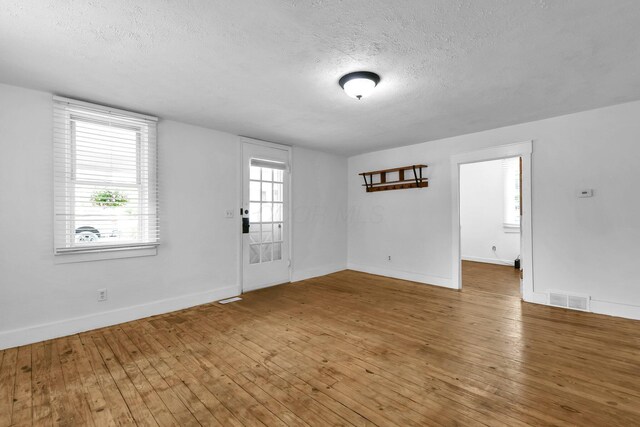 221 W Mulberry St, Baltimore, OH 43105 - spare room featuring a textured ceiling, baseboards, and wood-type flooring