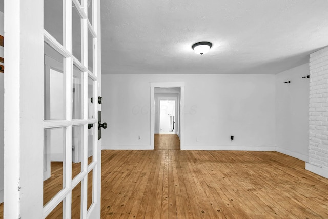 221 W Mulberry St, Baltimore, OH 43105 - spare room featuring hardwood / wood-style floors, a textured ceiling, and baseboards