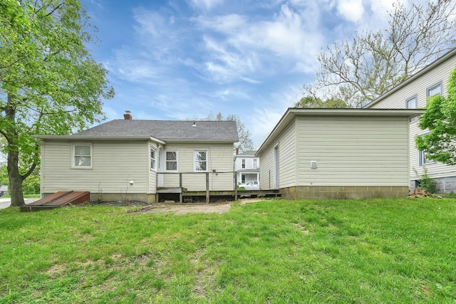 221 W Mulberry St, Baltimore, OH 43105 - back of property featuring a deck, a yard, and a chimney