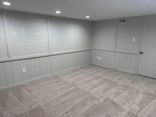 5076 Dalmeny Ct, Columbus, OH 43220 - finished below grade area with carpet, recessed lighting, and a decorative wall