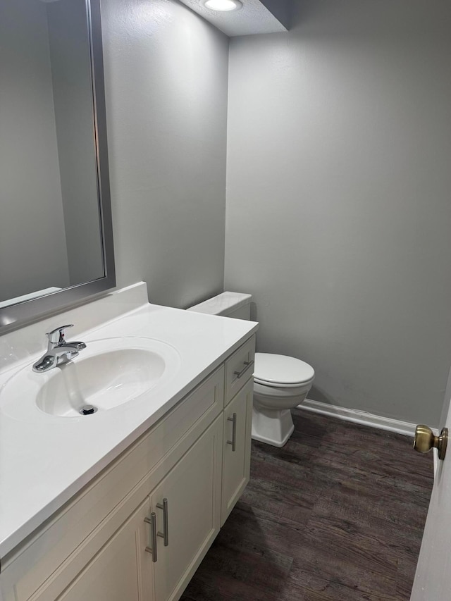 5076 Dalmeny Ct, Columbus, OH 43220 - half bath featuring wood finished floors, vanity, and toilet