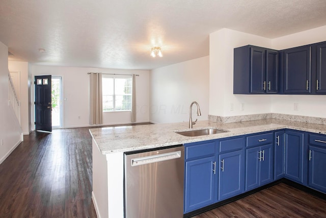 960 Hartford Village Blvd, Columbus, OH 43228 - kitchen featuring stainless steel dishwasher, a sink, blue cabinetry, and a textured ceiling