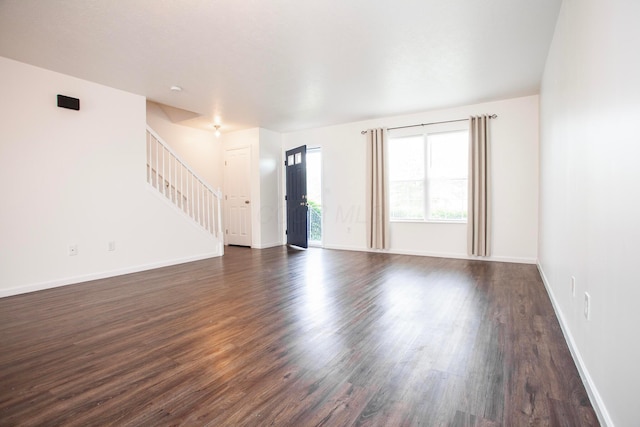 960 Hartford Village Blvd, Columbus, OH 43228 - unfurnished living room featuring stairway, dark wood-style floors, and baseboards