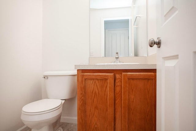 960 Hartford Village Blvd, Columbus, OH 43228 - half bathroom featuring toilet, vanity, baseboards, and tile patterned floors