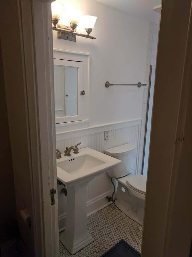 204-206 E Blenkner St, Columbus, OH 43206 - half bathroom with toilet, wainscoting, and tile patterned floors