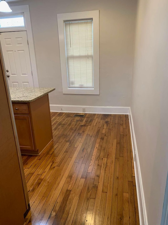 204-206 E Blenkner St, Columbus, OH 43206 - unfurnished dining area with hardwood / wood-style flooring and baseboards