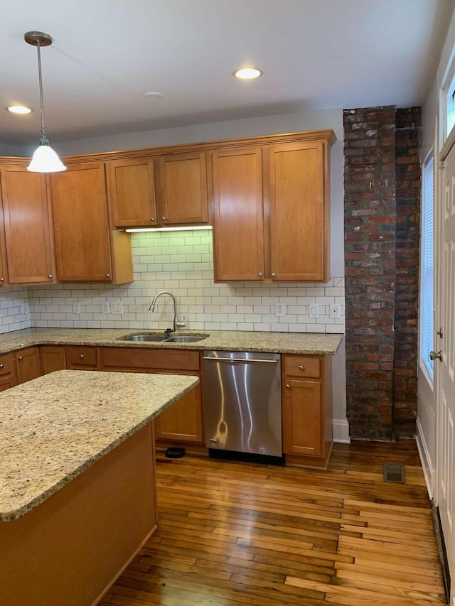 204-206 E Blenkner St, Columbus, OH 43206 - kitchen with dishwasher, a sink, wood-type flooring, brown cabinets, and recessed lighting