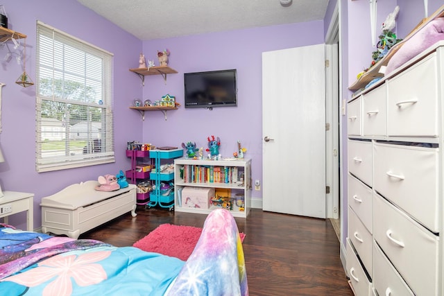 2806 Claude Dr, Columbus, OH 43207 - bedroom with wood finished floors and a textured ceiling