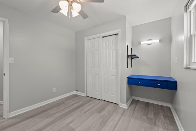 4187 Medway Ave, Columbus, OH 43213 - unfurnished bedroom with wood finished floors, a closet, baseboards, and ceiling fan
