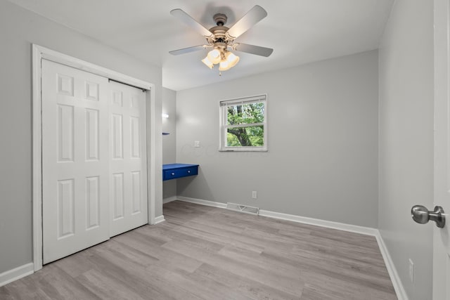 4187 Medway Ave, Columbus, OH 43213 - unfurnished bedroom with wood finished floors, a closet, baseboards, and ceiling fan