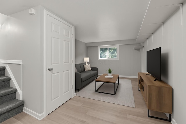 4187 Medway Ave, Columbus, OH 43213 - living area with light wood-type flooring, baseboards, and stairway