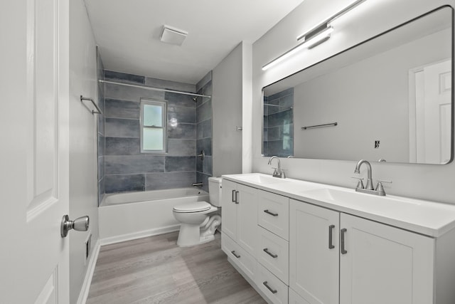 4187 Medway Ave, Columbus, OH 43213 - bathroom with toilet, wood finished floors, washtub / shower combination, and double vanity