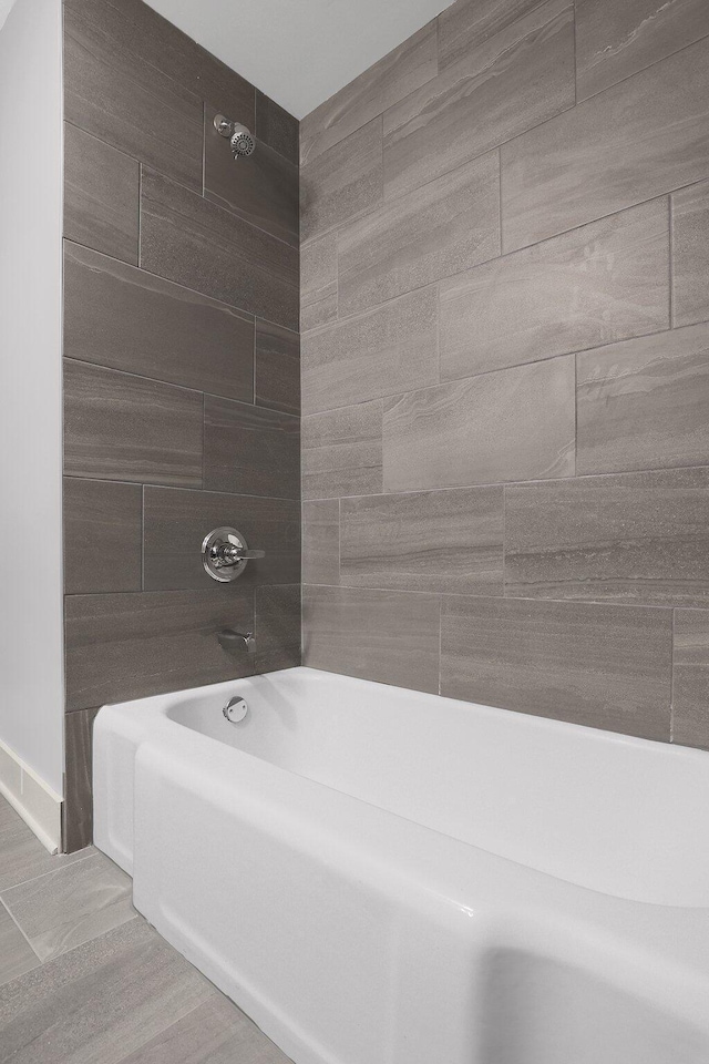 full bath featuring bathing tub / shower combination