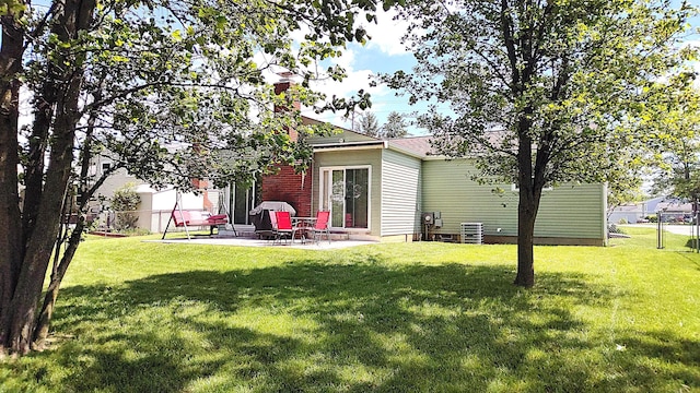 245 Hubbard Rd, Galloway, OH 43119 - back of house with a patio, a chimney, and central AC