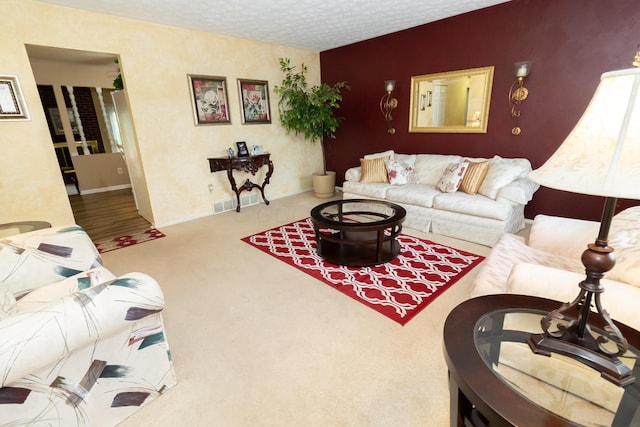 245 Hubbard Rd, Galloway, OH 43119 - living area featuring carpet floors, a textured ceiling, and baseboards