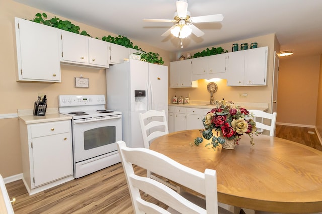 245 Hubbard Rd, Galloway, OH 43119 - kitchen featuring white appliances, white cabinets, light wood finished floors, and ceiling fan