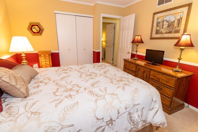 245 Hubbard Rd, Galloway, OH 43119 - bedroom featuring a closet, ornamental molding, and carpet