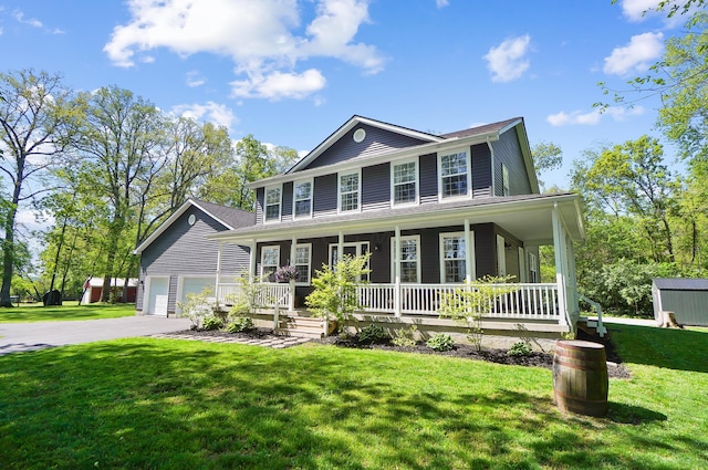 7353 Selma Pike, South Charleston, OH 45368 - colonial house with a porch, a front yard, and an outbuilding